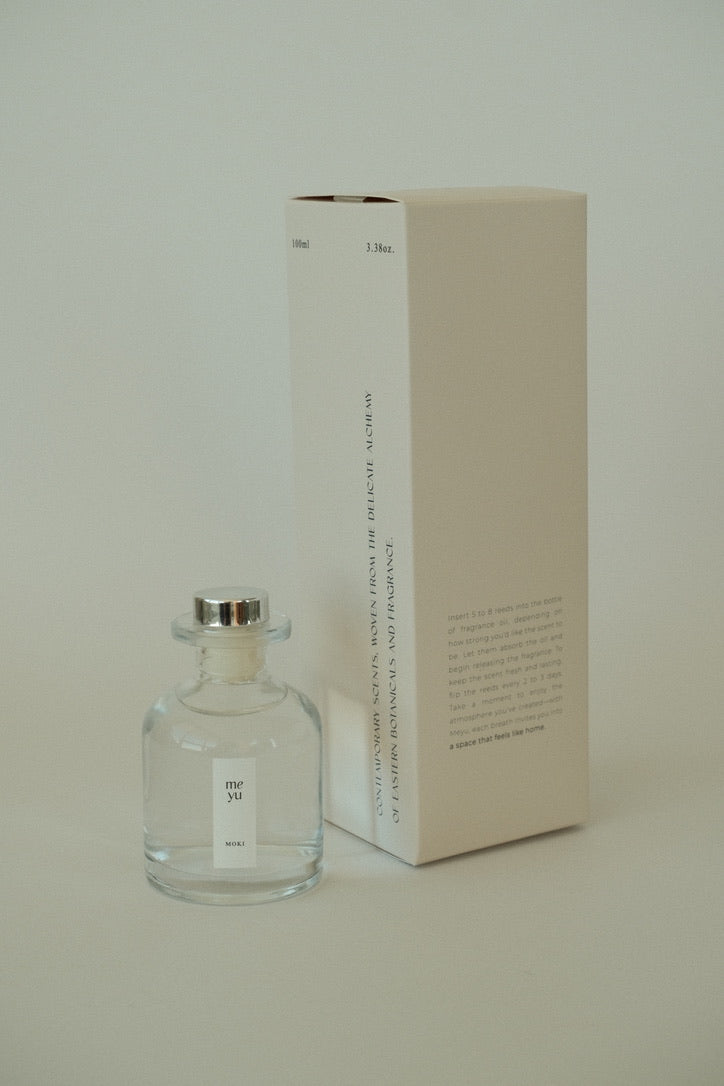 Arun reed diffuser displayed next to its luxury packaging box; home fragrance by Meyu Vancouver, perfect for gifts.