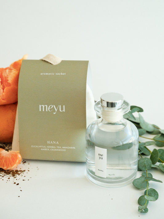 Hana gift set with reed diffuser and scented sachet on white background with eucalyptus and mandarin accents - calming home fragrance by Meyu Vancouver